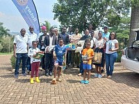 Members of RC Butabika pose with relief items collected