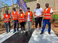 Members of RC Butabika Royals take a photo after painting road humps in Mutungo and Butabika area in 2023